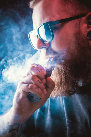 Research shows that vaping is the most effective tool to help quit smoking 1 Man vaping with e-liquid uk from Rainbowvapes